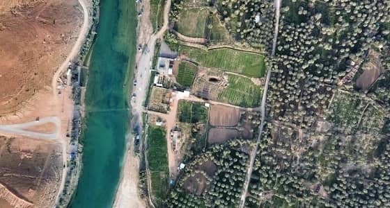 بالصور.. وادي المشقر بالمجمعة في أبهى حلله من السماء