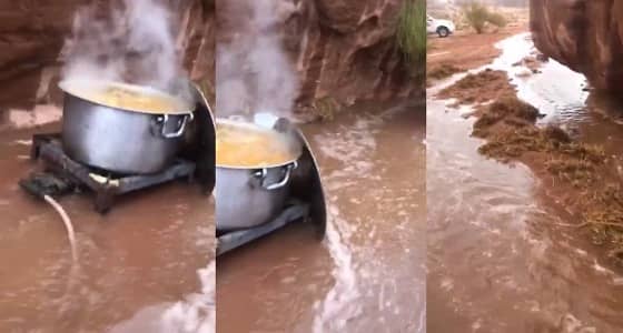 بالفيديو.. طهي الغداء داخل متنزه وسط السيول