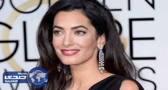 أمل كلوني تتنازل عن فستان زفافها