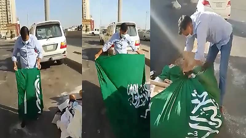 شاهد..شخص يعثر على علم المملكة ملقيًا في الشارع وهذه ردة فعله