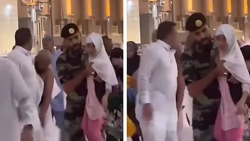لافتة إنسانية لرجل أمن مع الأطفال أثناء الرياح في مكة..فيديو